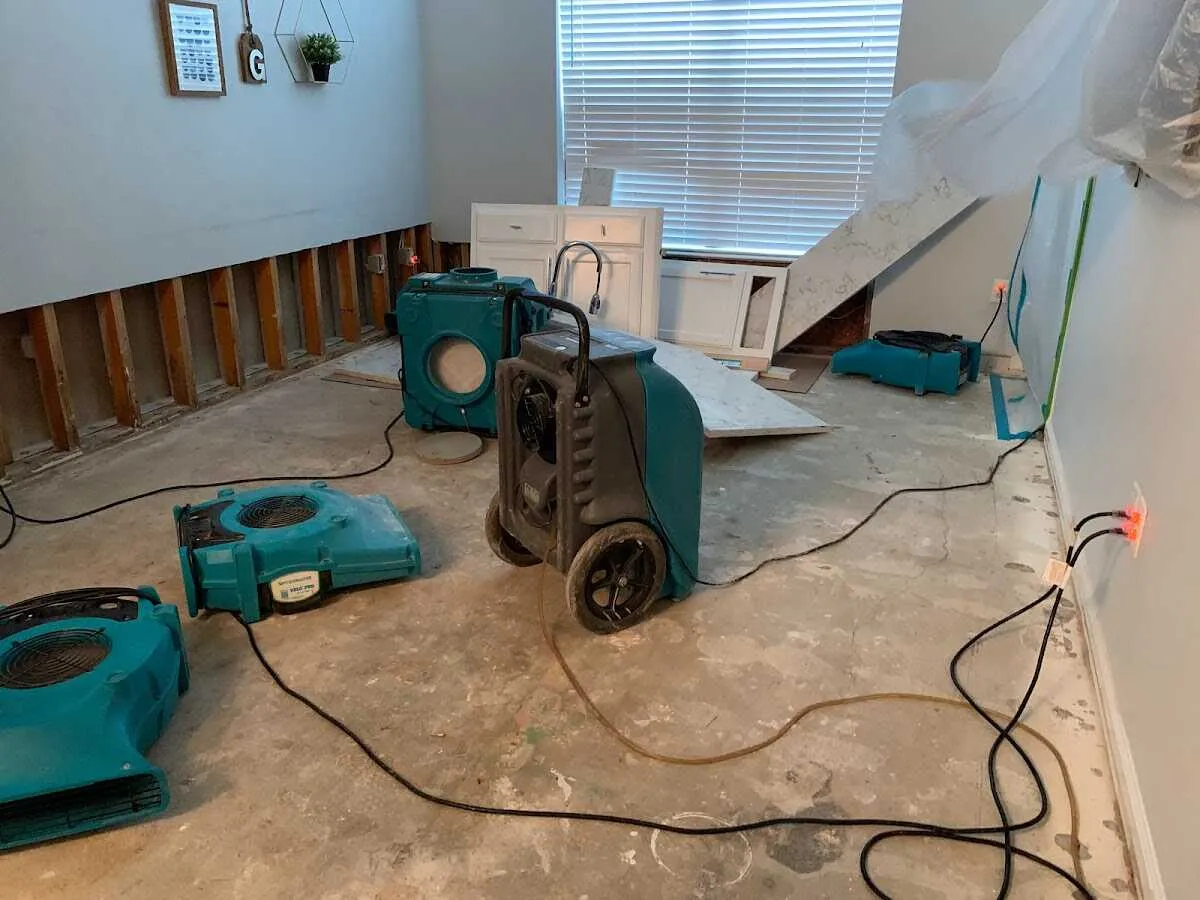 Dehumidifier in flood-cut room for Water Damage Restoration in Forest